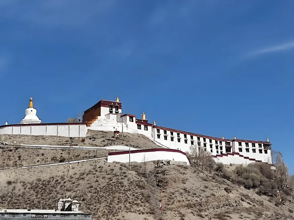 Shiazhunli Monastery in Shigatse Tibet, traditional golden roof monastery exterior, historic Gelug sect Buddhist temple, one of the best temples in Tibet.