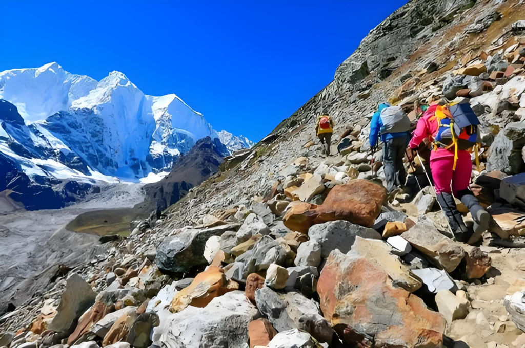 A group of people climbing Mount Everest Camp